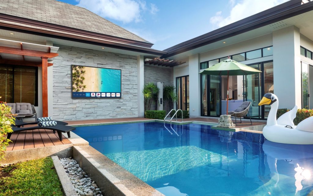 Neptune Partial Sun Outdoor Smart TV installed in backyard